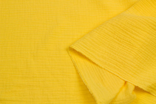 istock Fabric yellow cotton muslin. Yellow Textile Drapery 1391582965