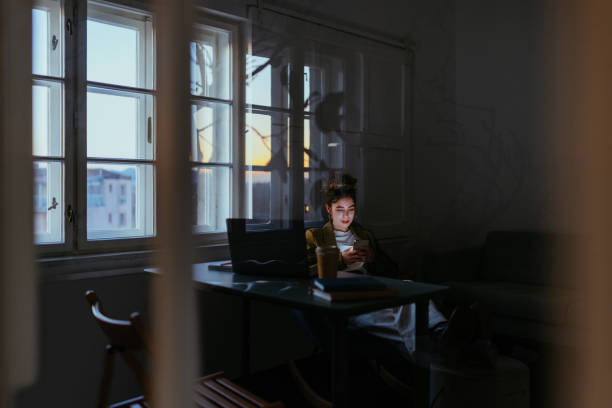 istock Woman working at modern office and using phone 1391584625