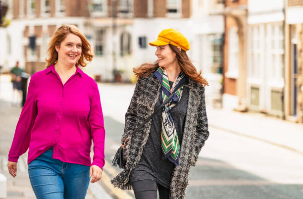 istock Friends having a laugh on the street 1391585966