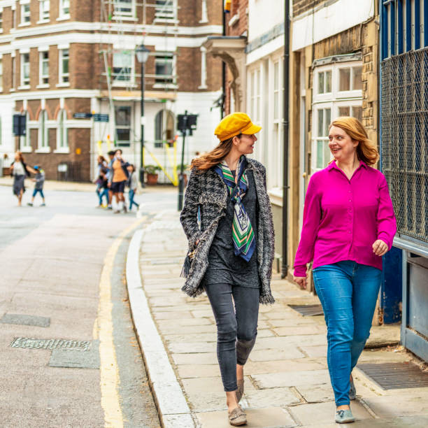 istock Friends sharing a joke on the street 1391585983