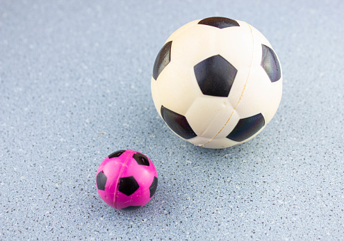 The Small soccer ball in hand. Miniature soccer ball.