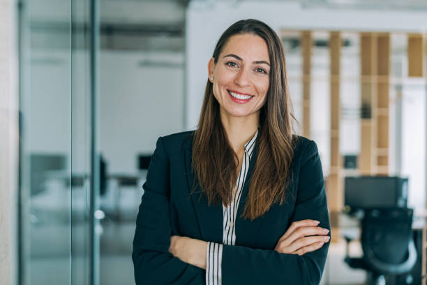 istock Confident businesswoman in modern office. 1391590174