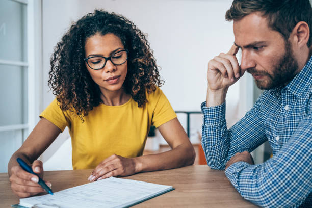 istock Business people signing a contract. 1391590494
