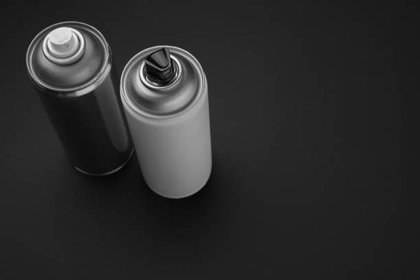 istock Cans of different graffiti spray paints on black background, above view. Space for text 1391590500