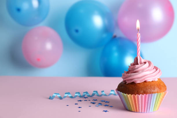 istock Delicious birthday cupcake on color background, space for text 1391590583