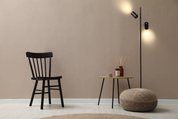 istock Stylish room interior with pouf, chair and decor elements 1391590830