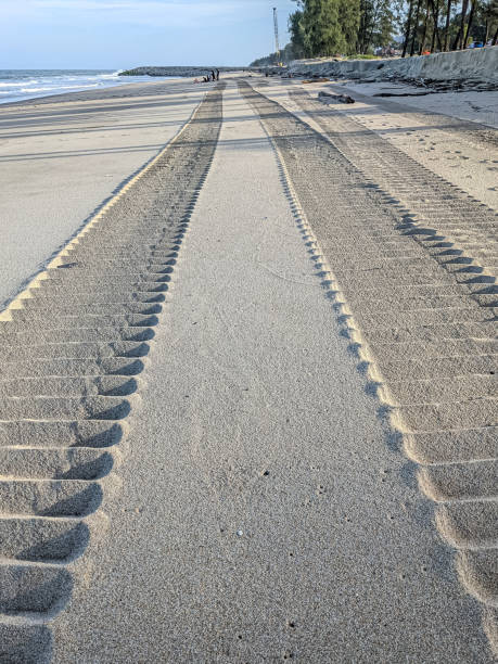 istock Former vehicles chained on beach sand. 1391594521