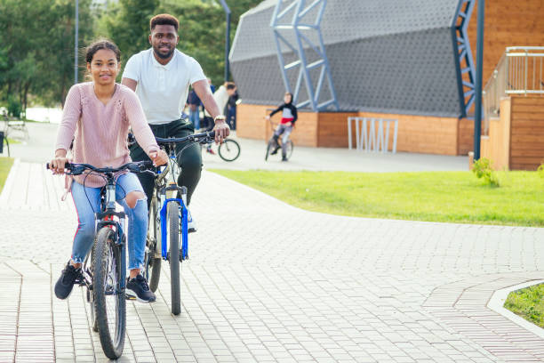 istock mixed race couple taking a cycle on rent phone app 1391594639