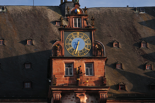Big Clock Of The Old City Hall in Marburg Hesse Germany On A Beautiful Spring Day With A Clear Blue Sky