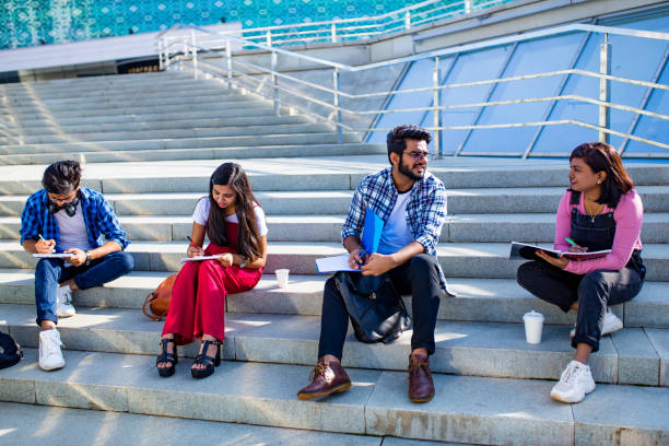 istock indian students keeping distance and do home work outdoors 1391598127