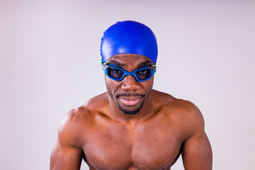 african american man trainer has wet muscular body, being in good mood after swimming and diving.