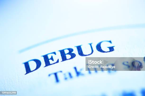 Debug Defined In A Business Dictionary Stock Photo - Download Image Now - Black Color, Blue, Book