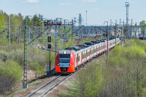 istock Passenger train moves at summer morning. 1391605600