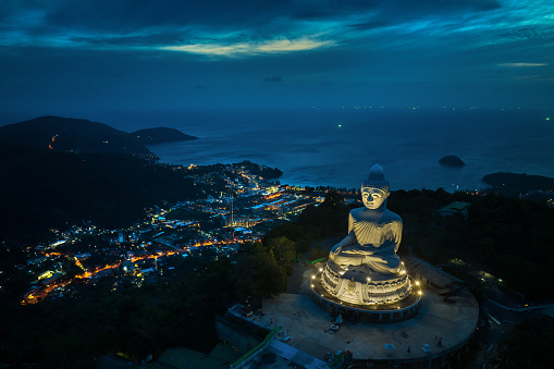 Aerial view during sunset of Phuket Big Buddha, or The Great Buddha of Phuket, is a seated Maravija Buddha statue in Phuket, Thailand.
