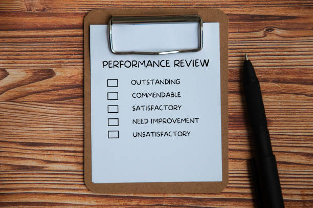 Top view of performance Appraisal checklist on clip board with pen and wooden cover background. Top view of performance Appraisal checklist on clip board with pen and wooden cover background. Performance review concept checkbox photos stock pictures, royalty-free photos & images