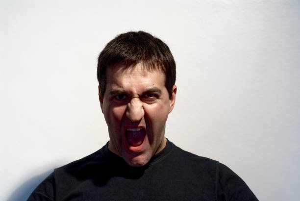 adult man making curious expressions with face on white background