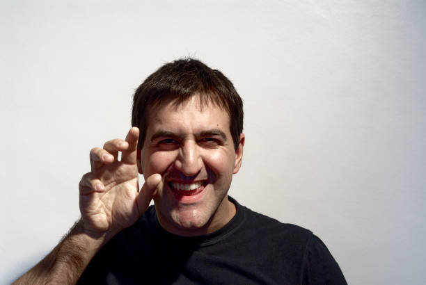 adult man making curious expressions with face on white background