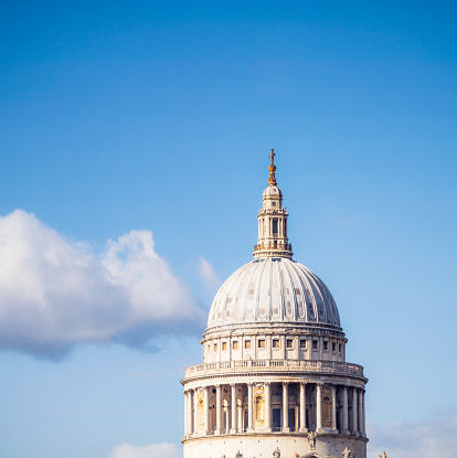 The famous dome of St Paul's Cathedral in central London, seen against a sunny, summer sky. The dome was completed early in the 18th Century, and remains one of London's most recognised landmarks.