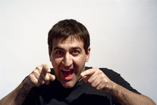 adult man making curious expressions with face on white background