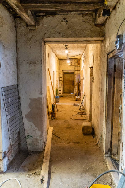 istock Apocalyptic View in Old Abandoned Barn Hallway 1391618617
