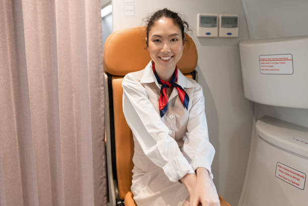 istock Portrait Happy asian air hostess in the plane 1391619076