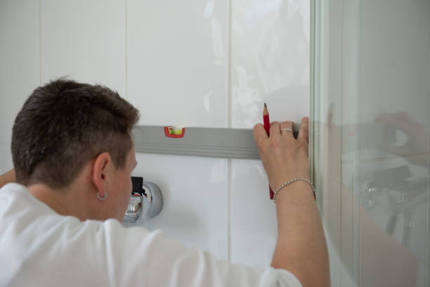 istock Woman repairs bathroom 1391619776