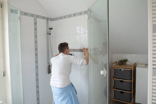 istock Woman repairs bathroom 1391619782
