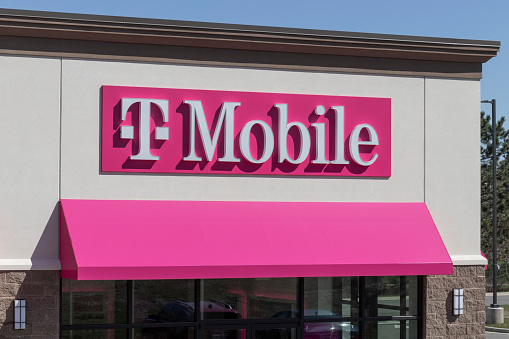 Logansport - Circa April 2022: T-Mobile cell and mobile phone store. T-Mobile merged with Sprint to create a larger 5G internet and communications network.