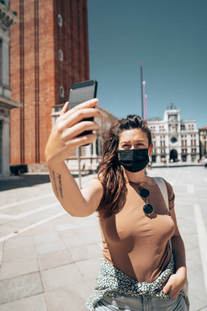 istock woman with face mask in Venezia 1391625921