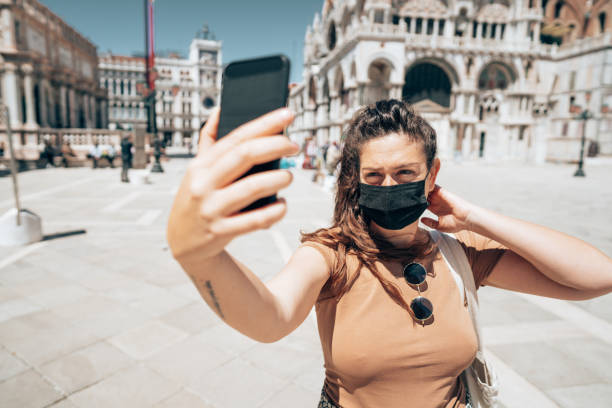 istock woman with face mask in Venezia 1391625944