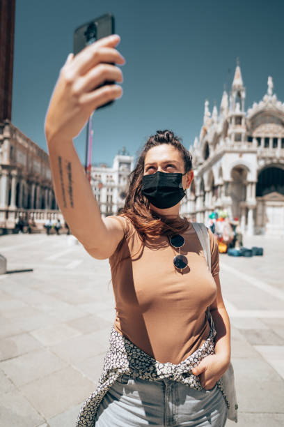 istock woman with face mask in Venezia 1391625958