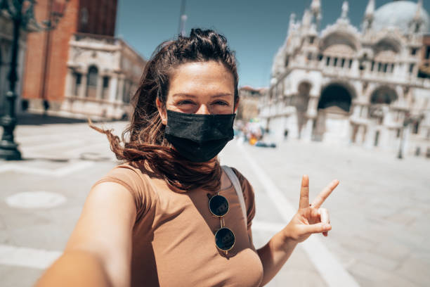 istock woman with face mask in Venezia 1391625980