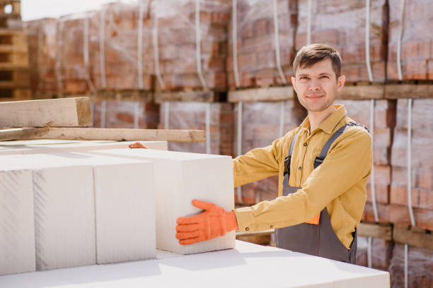 istock man contractor builder is holding an autoclaved aerated concrete block aac on a construction site. 1391626439