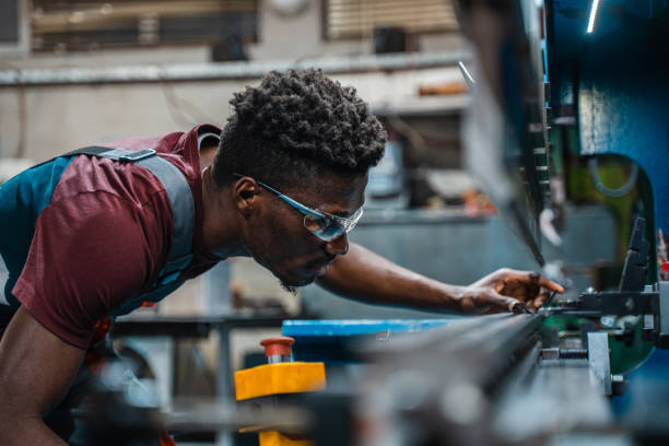 istock Afroamerican bluecollar worker in a factory 1391628618