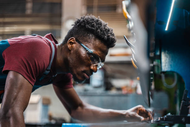 istock Afroamerican bluecollar worker in a factory 1391628639
