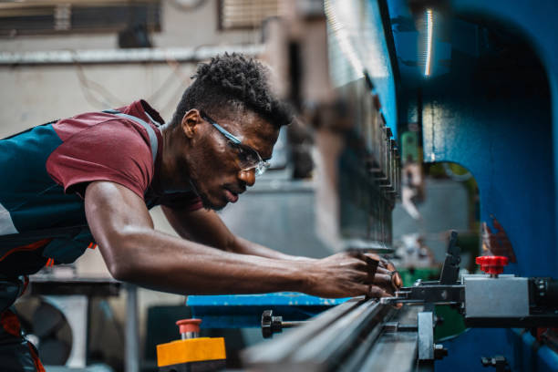 istock Afroamerican bluecollar worker in a factory 1391628642