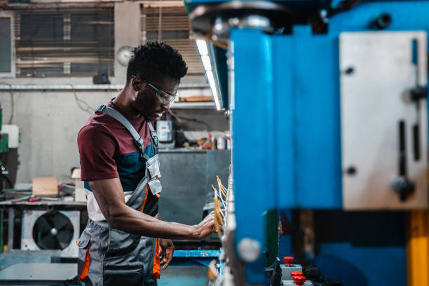 istock Afroamerican bluecollar worker in a factory 1391628681