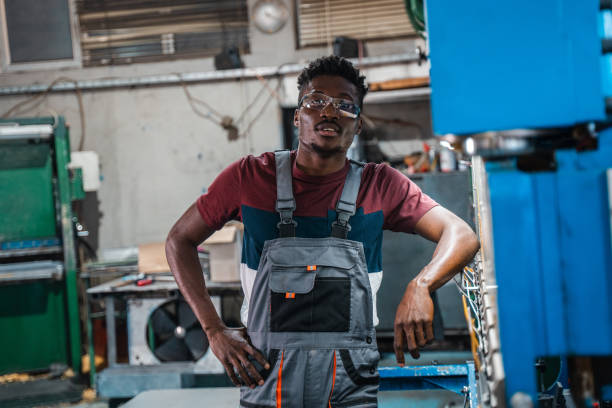 istock Afroamerican bluecollar worker in a factory 1391628691