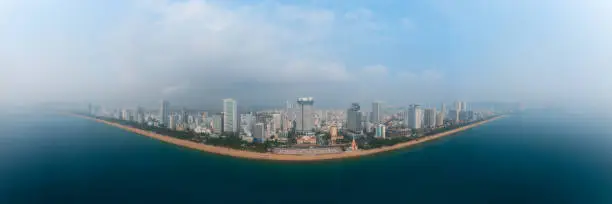 Drone view panorama Nha Trang city from the sea in a cloudy day, Khanh Hoa province, central Vietnam