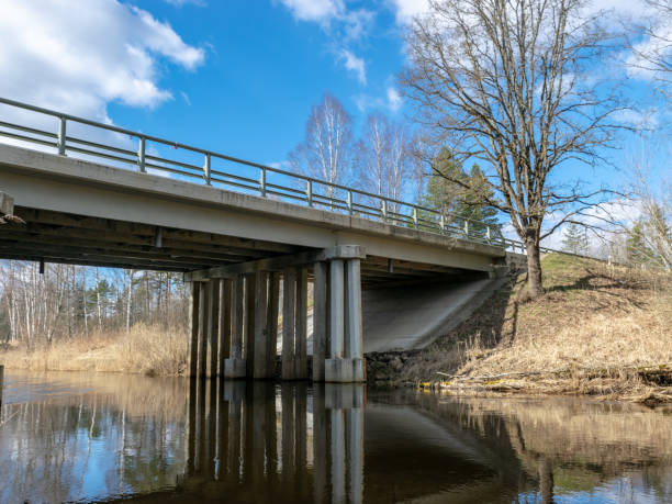 istock sunny spring landscape with a bridge over the river 1391636226