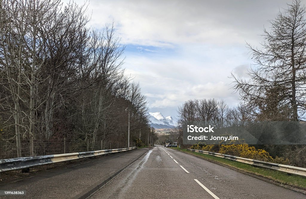 Highway to the mountains In Sutherland in the very north of Scotland Asphalt Stock Photo