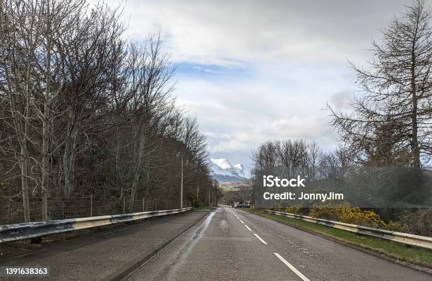 Highway To The Mountains Stock Photo - Download Image Now - Asphalt, Color Image, Driving