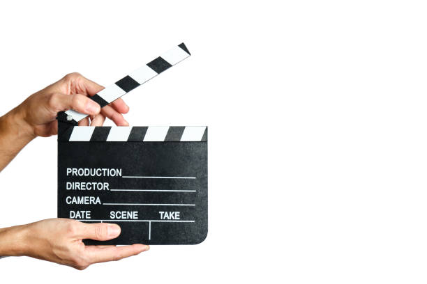 istock man hands holding a movie clapperboard on white background 1391639624