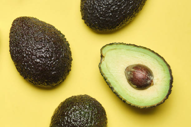 istock macro image of avocados on yellow background from above 1391639631