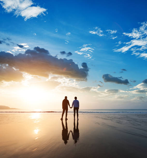 istock Couple holding hands at beach 1391640760