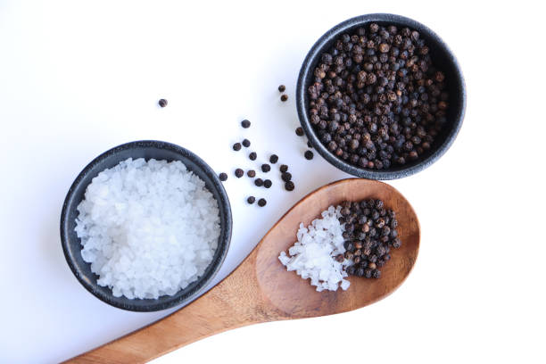 istock Seasoning salt granules and black peppercorns 1391642045