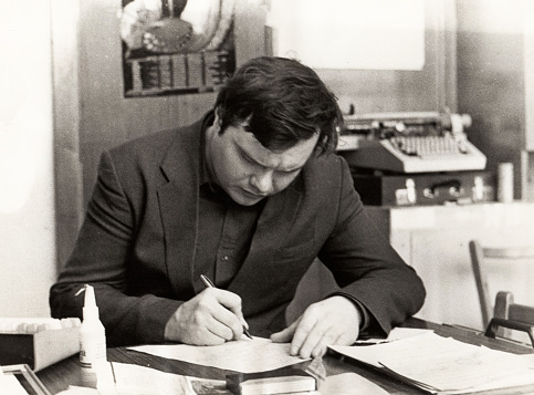 Dnepropetrovsk, USSR - circa 1982: A young researcher at the Dnepropetrovsk Metallurgical Institute makes manual calculations without the use of a microcalculator and a personal computer.