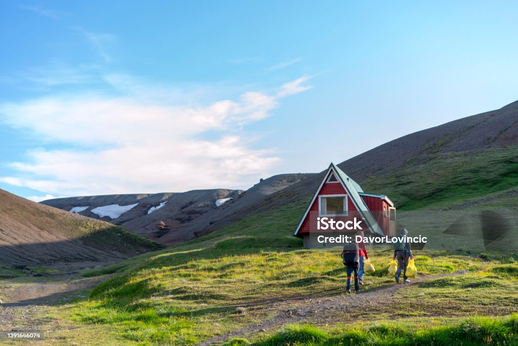 Senior women, tourists at Highlands camping Kerlingarfjoll on Iceland Senior women caring bags with food at Kerlingarfjoll resort, Camping and and cabin house.  Trail within 4 hours to geothermal area. Camping Stock Photo