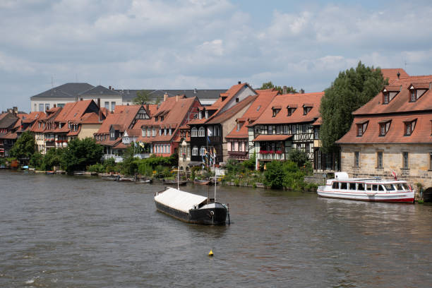 Little Venice and Boats on Regnitz River in Bamberg, Germany Bamberg, Germany - July 20, 2021: View of Klein Venedig (Little Venice), a former fishermen's district, and boats on the Regnitz river. klein venedig photos stock pictures, royalty-free photos & images