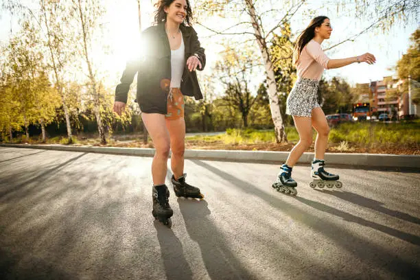 Photo of Young women skating on a sunny day